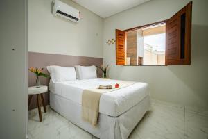 Postel nebo postele na pokoji v ubytování Casa no PREÁ COM PISCINA !