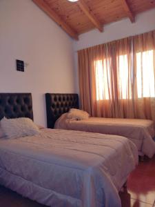 Tempat tidur dalam kamar di Muy Patagónica, Casa de Campo