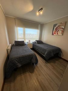 Postel nebo postele na pokoji v ubytování PuertoVarasC101