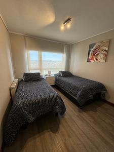 Postel nebo postele na pokoji v ubytování PuertoVarasC101 + 19 fotografií