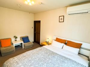 美景西浦山林小屋客房内的一张或多张床位