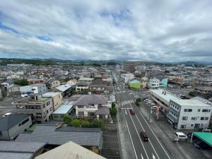 an aerial view of a city with cars and buildings at Hotel Route-Inn Fujieda-Eki Kita in Fujieda