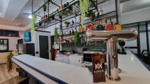 a bar at a restaurant with a counter top at Hotel Asturias in Viña del Mar +26 photos
