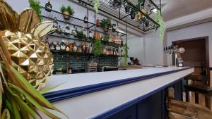 a bar with a pineapple on the counter at Hotel Asturias in Viña del Mar