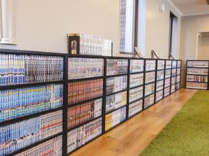 a shelf of dvds in a book store at KOKO HOTEL Shizuoka in Shizuoka
