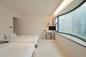 Aank Hotel Wolgot客房内的一张或多张床位