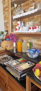 un buffet con piatti e cibo su un tavolo di Adria House Dubrovnik by the sea a Zaton