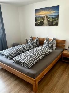 a bedroom with two beds with pillows at Business-Apartment Braun in Abstatt