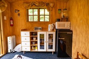 Kuchyň nebo kuchyňský kout v ubytování Morepork Gully cabin