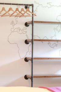 a shelf with a world map on the wall at Zeiserhof in Ramsau am Dachstein