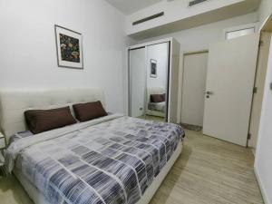 Säng eller sängar i ett rum på M City 2 BEDROOM KLCC