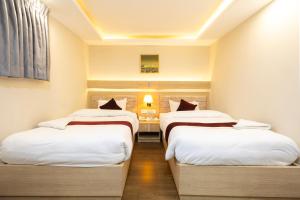 Voodi või voodid majutusasutuse Divine Kathmandu Hotel toas