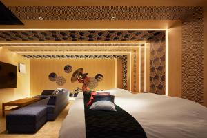 Кровать или кровати в номере Yatomi Hotel Nuqu Natural Hot Spring