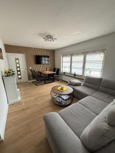 a living room with a couch and a table at Krune Ferienwohnung in Boppard