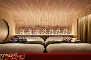 Кровать или кровати в номере Yatomi Hotel Nuqu Natural Hot Spring