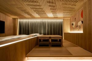 Кровать или кровати в номере Yatomi Hotel Nuqu Natural Hot Spring
