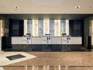 a lobby with a reception desk in a building at Hotel Villa Fontaine Tokyo-Kayabacho in Tokyo