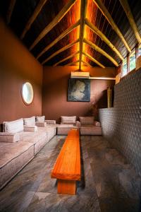 a room with couches and a wooden table in it at O2 Villas Ella in Ella