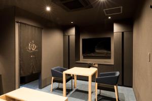 Телевизор и/или развлекательный центр в Yatomi Hotel Nuqu Natural Hot Spring