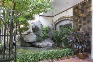 a fountain in the courtyard of a building at Spring Hotel in Can Tho