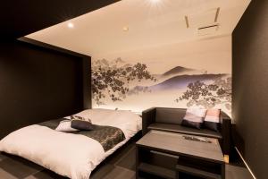 Кровать или кровати в номере Yatomi Hotel Nuqu Natural Hot Spring