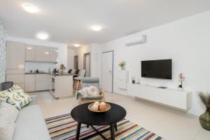 a living room with a couch and a table at Apartments Stella Per Te in Vir