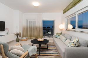 a living room with a couch and a table at Apartments Stella Per Te in Vir