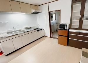 Köök või kööginurk majutusasutuses Sorapaku Shibun Sky House