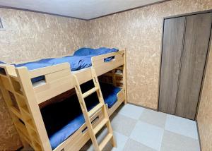 Voodi või voodid majutusasutuse Sorapaku Shibun Sky House toas