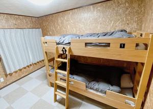 Voodi või voodid majutusasutuse Sorapaku Shibun Sky House toas