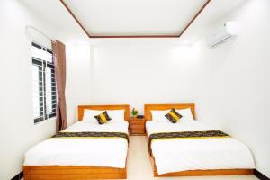 Ένα ή περισσότερα κρεβάτια σε δωμάτιο στο Moonlight Hotel QN - by BAY LUXURY