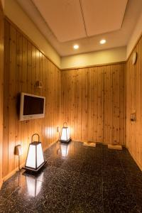 Телевизор и/или развлекательный центр в Yatomi Hotel Nuqu Natural Hot Spring