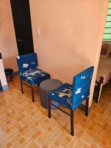 two blue chairs and a ottoman in a room at Mel's Place 2BR Apartment Unit2 in Batangas City in Batangas City