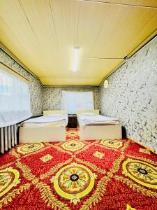 a bedroom with two beds in a room at City Hostel & Tours in Ulaanbaatar