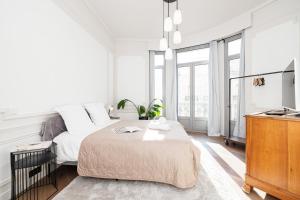 Postel nebo postele na pokoji v ubytování Vacances Au Palace - Happy Rentals