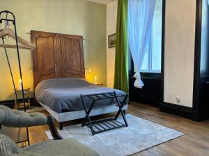 Postel nebo postele na pokoji v ubytování Maison à la Guitarde - Hôtel Particulier Hippolyte