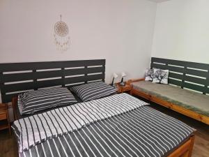 Postel nebo postele na pokoji v ubytování Penzion a Pizzerie Na Záložně