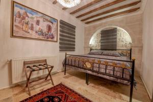 Postel nebo postele na pokoji v ubytování Cappadocia Vera Inn