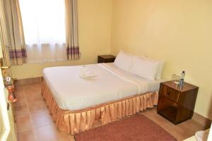 Wagon Wheel Hotel Eldoret客房内的一张或多张床位