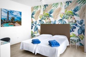 Posteľ alebo postele v izbe v ubytovaní Hotel Valencia