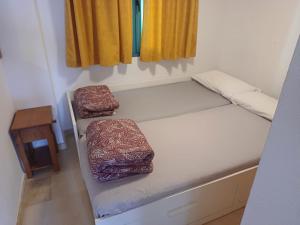 Łóżko lub łóżka w pokoju w obiekcie Precioso apartamento con piscina cerca de la playa