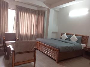 Katil atau katil-katil dalam bilik di Rudra Darshan Bed & Breakfast +4 gambar