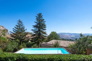 a swimming pool in the yard of a house at Dependance a Baglio il Corvo by Wonderful Italy in Gangi