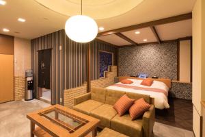 Кровать или кровати в номере Yatomi Hotel Nuqu Natural Hot Spring