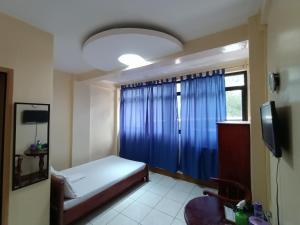 TV a/nebo společenská místnost v ubytování DISADECO Hostel