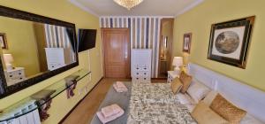 Postel nebo postele na pokoji v ubytování El Capricho de Cangas 2H - WiFi - Garaje - Hidromasaje - VUT-3001-AS