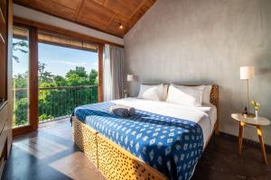 Postel nebo postele na pokoji v ubytování MASMARA Resort Canggu