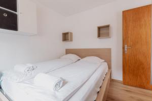 Postel nebo postele na pokoji v ubytování Appartement ski in&out à Thyon