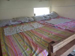 a large bed in a room with two twin beds at Affordable Family Loft near SM Uptown Cagayan de Oro in Cagayan de Oro