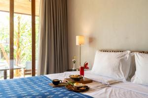Postel nebo postele na pokoji v ubytování MASMARA Resort Canggu